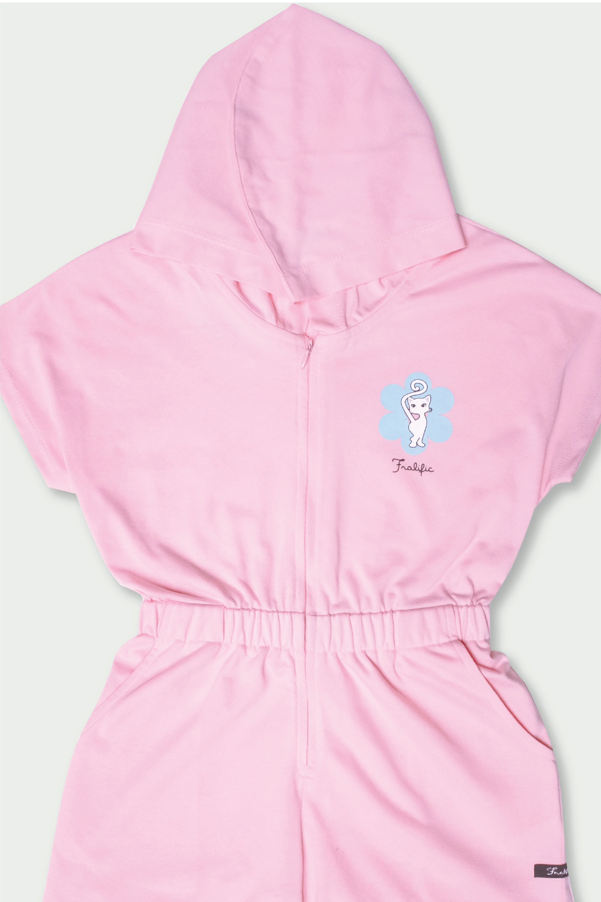 Flat lay of pink girls cotton romper with hood and elastic waist
